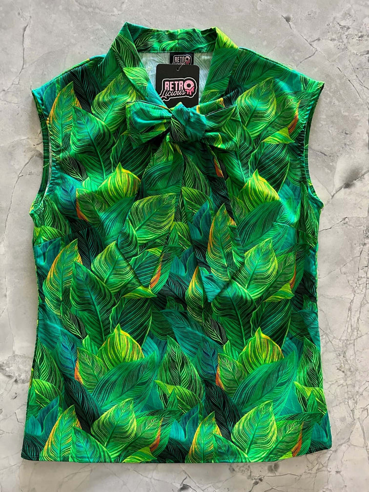 This top is for the vintage lover at heart! Shown in our leaves print, this 100% cotton top features bust darts for a flattering silhouette, a side zippered closure for ease of wear, and an oversized bow at the neckline for that perfect 1950's inspired look. 