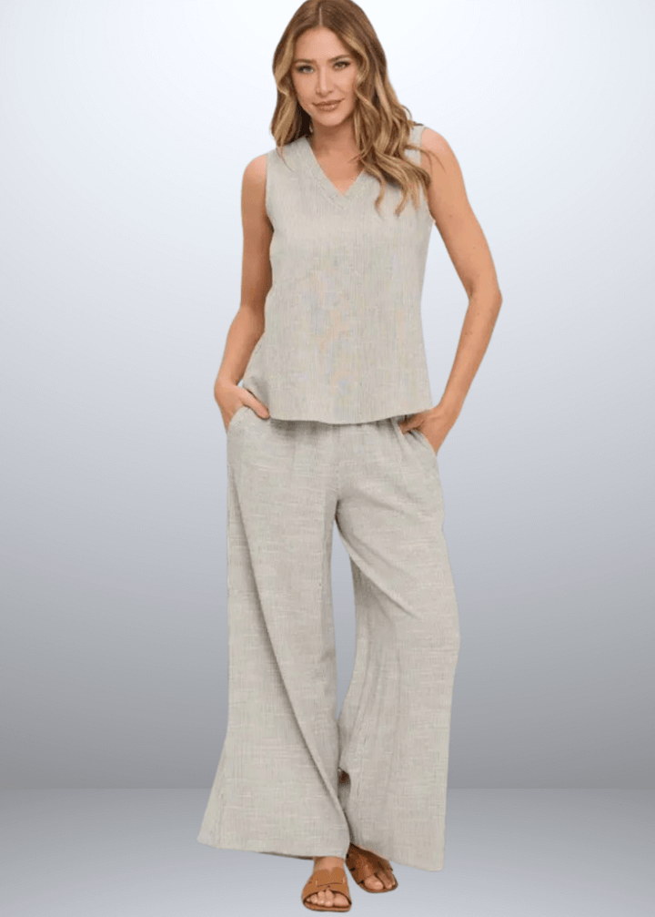 Elevate your casual wardrobe with the Made in USA Women's Selah V-Neck Sleeveless Top. Featuring a classic charcoal stripe on ivory and crafted from a breathable cotton, rayon, and linen blend | Renee C Style 5114P