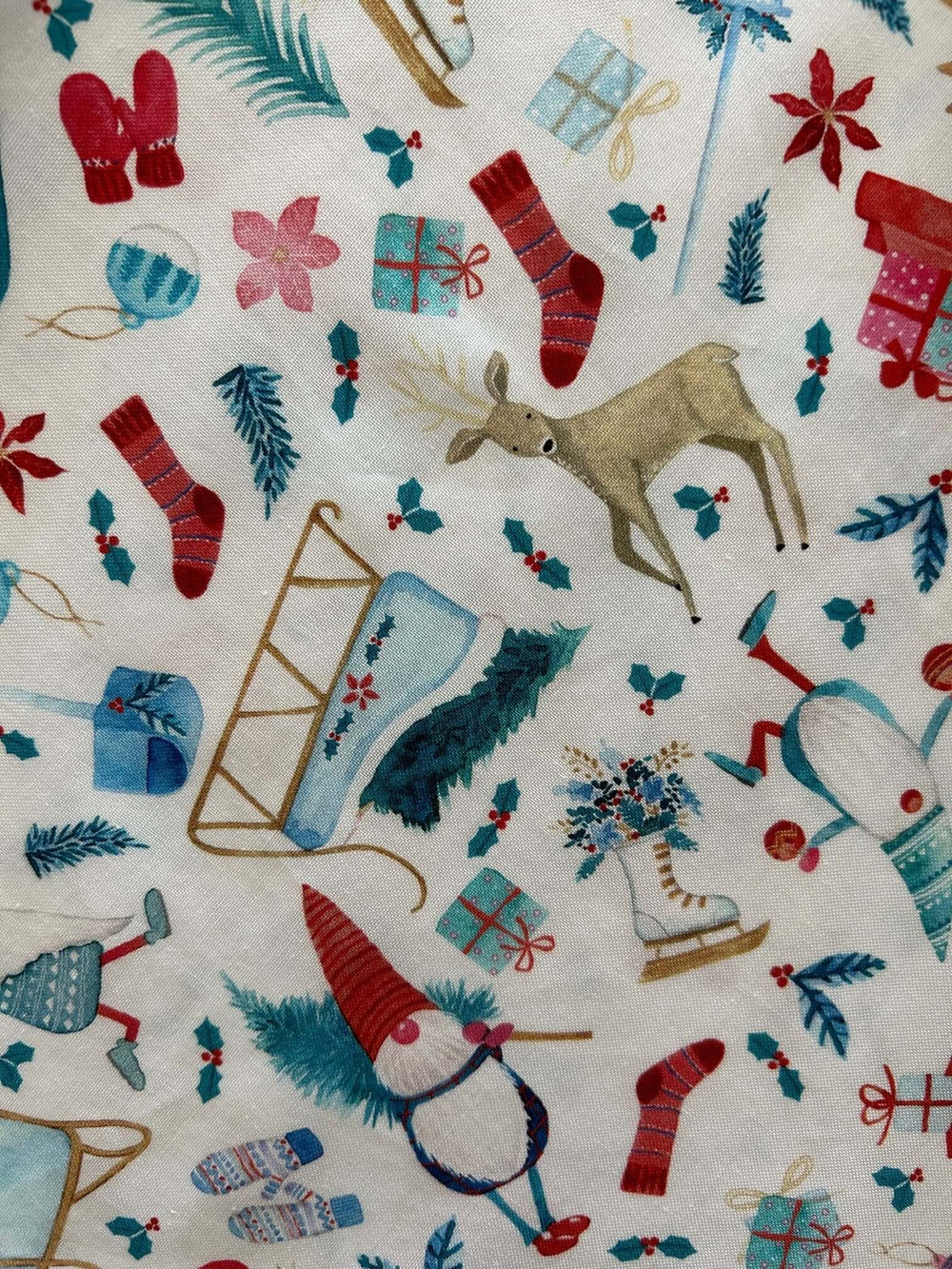 Introducing our Winter Cheer Vintage Dress. This dress boasts a fun and playful print featuring gnomes, sleds, ice skates, mittens, and reindeer. It's a whimsical and festive choice for your winter wardrobe. Spread the joy of the season with this unique and charming piece! A vintage style piece with fun, modern details in our Winter Cheer print. Made from 100% cotton, this classic 1950's inspired dress features a high neckline, longer length skirt with hidden side pockets and back zippered closure.