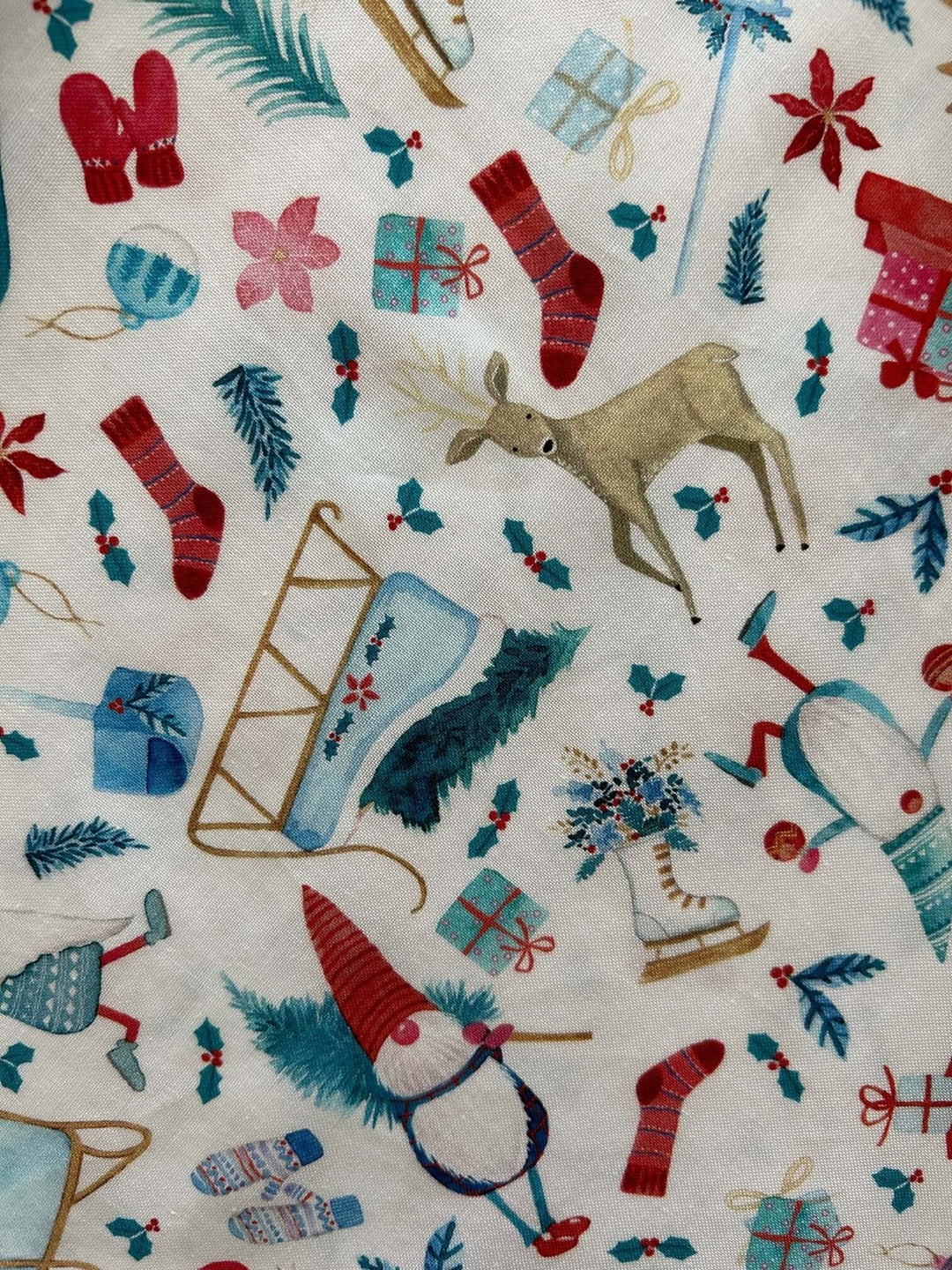 Introducing our Winter Cheer Vintage Dress. This dress boasts a fun and playful print featuring gnomes, sleds, ice skates, mittens, and reindeer. It's a whimsical and festive choice for your winter wardrobe. Spread the joy of the season with this unique and charming piece! A vintage style piece with fun, modern details in our Winter Cheer print. Made from 100% cotton, this classic 1950's inspired dress features a high neckline, longer length skirt with hidden side pockets and back zippered closure.