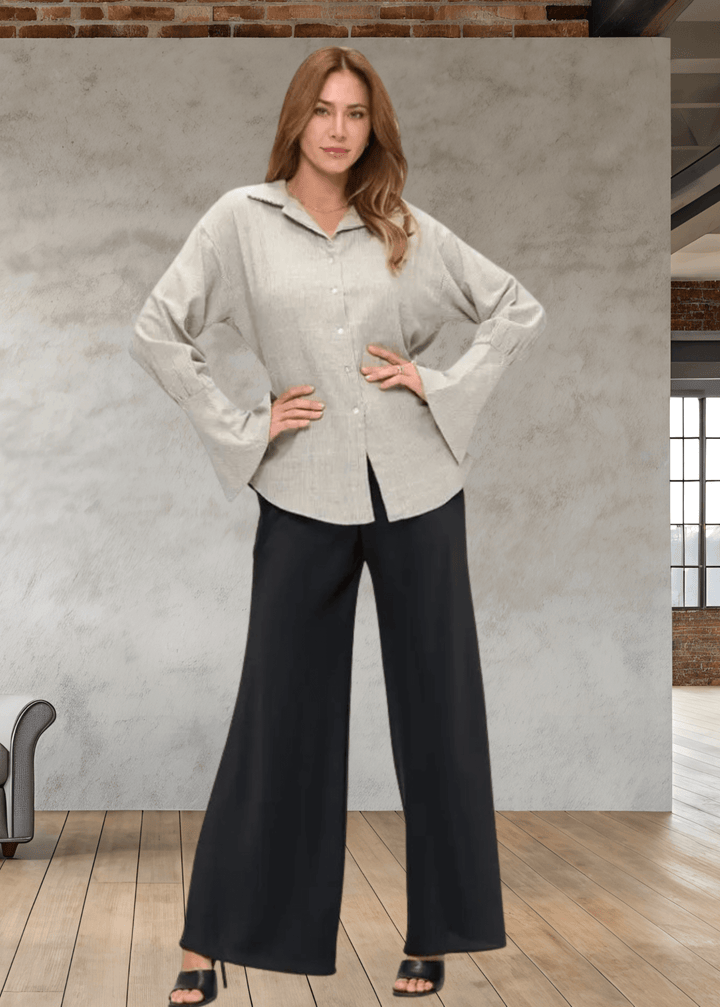 Elevate your wardrobe with the Made in USA Gabriella Cuff Detail Striped Top, featuring a classic collared design and long sleeves with stylish split bell cuffs. The tie-back detail adds a modern twist, while the subtle charcoal pinstripes on ivory make for a versatile, sophisticated look. Crafted from a breathable blend of cotton, rayon, and linen, this top offers all-day comfort and easy care with machine washable fabric. 