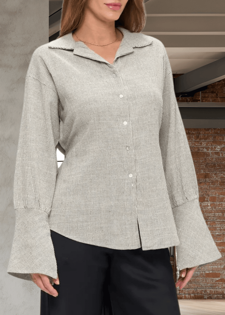 Elevate your wardrobe with the Made in USA Gabriella Cuff Detail Striped Top, featuring a classic collared design and long sleeves with stylish split bell cuffs. The tie-back detail adds a modern twist, while the subtle charcoal pinstripes on ivory make for a versatile, sophisticated look. Crafted from a breathable blend of cotton, rayon, and linen, this top offers all-day comfort and easy care with machine washable fabric. 