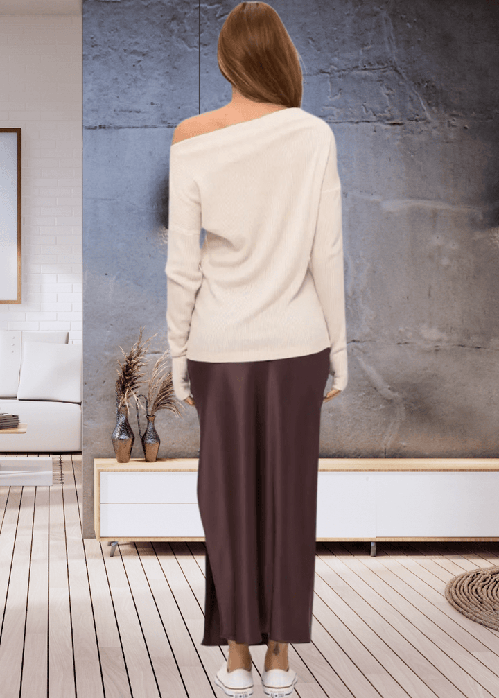 Experience ultimate comfort with the Grace Ribbed Knit Thumbhole Sweater, crafted in the USA from super soft rayon and spandex blend. Its relaxed dolman fit and boat neck create effortless style | Renee C Style# 5281TP