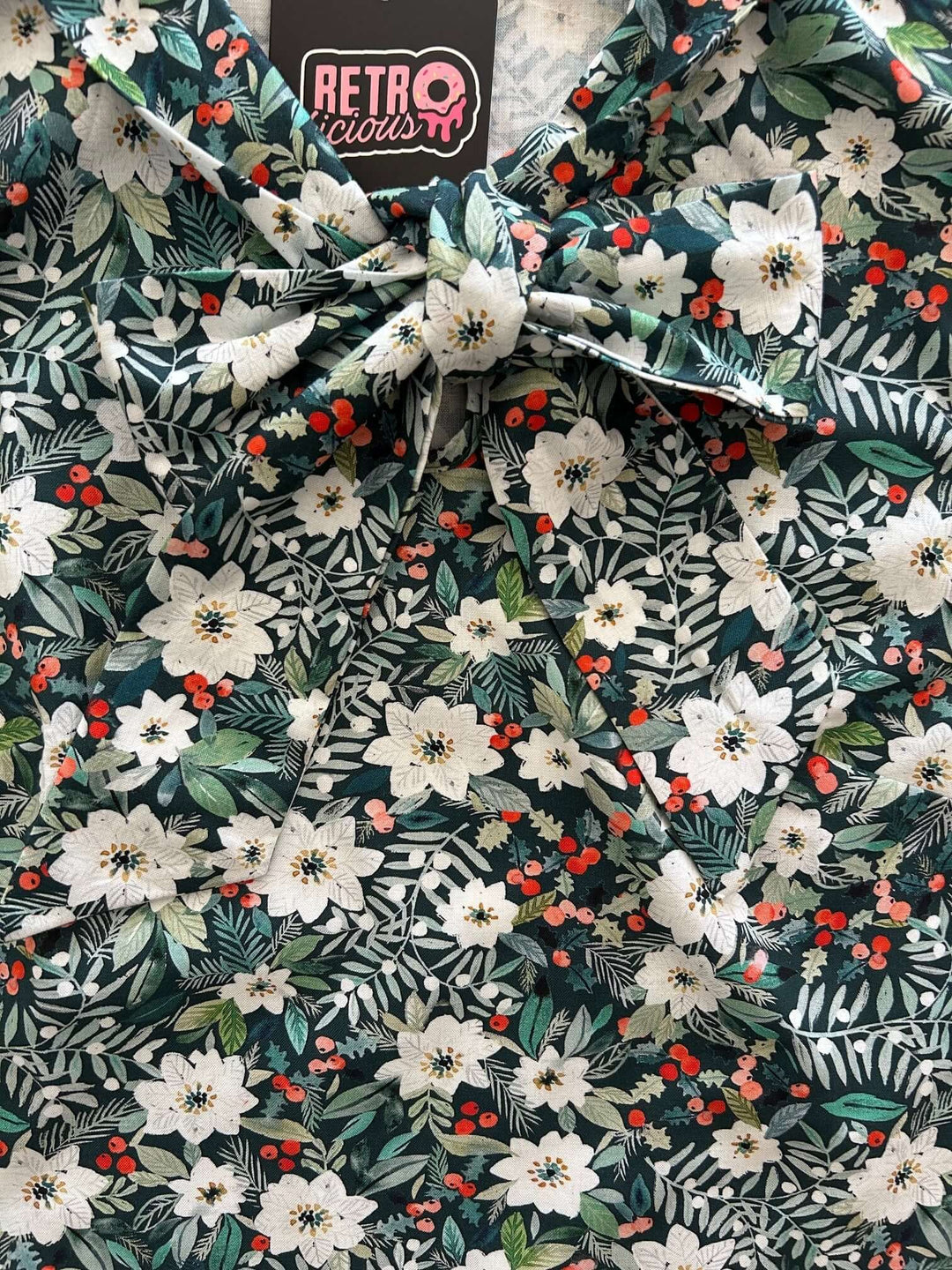 Made in USA, this women's top is for the vintage lover at heart! Now available in our Winter Floral print. This 100% cotton top features bust darts for a flattering silhouette, a side zippered closure for ease of wear