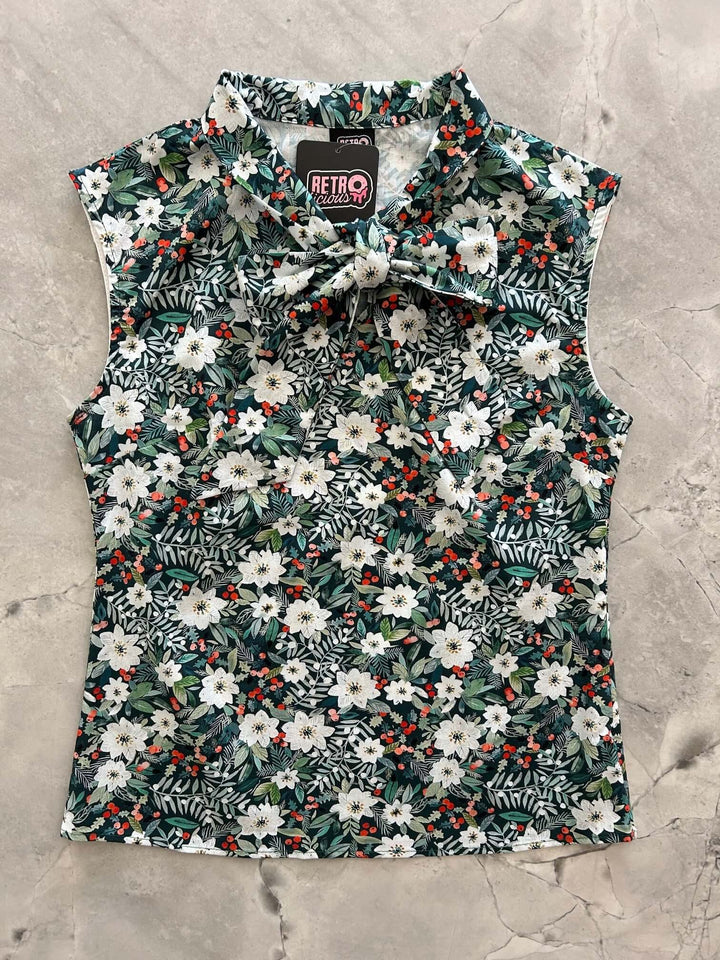 Made in USA, this women's top is for the vintage lover at heart! Now available in our Winter Floral print. This 100% cotton top features bust darts for a flattering silhouette, a side zippered closure for ease of wear