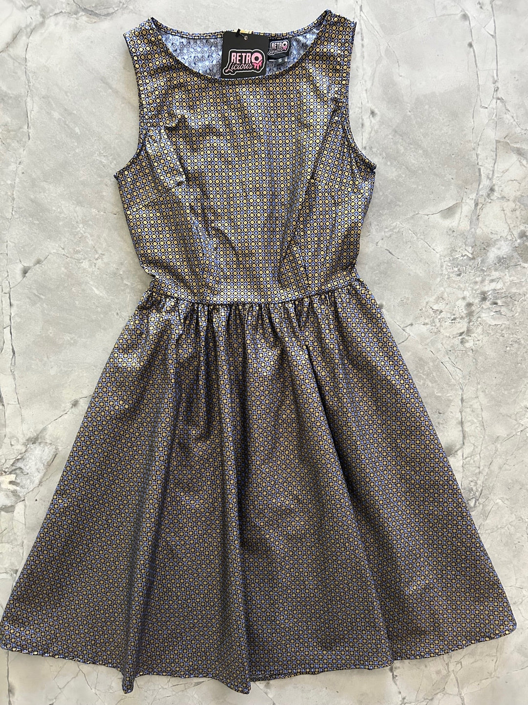 Made in USA. Shop the Isabella Vintage Dress by Retrolicious in 100% cotton, with a gold-and-blue print, high neckline, full skirt and hidden pockets.
