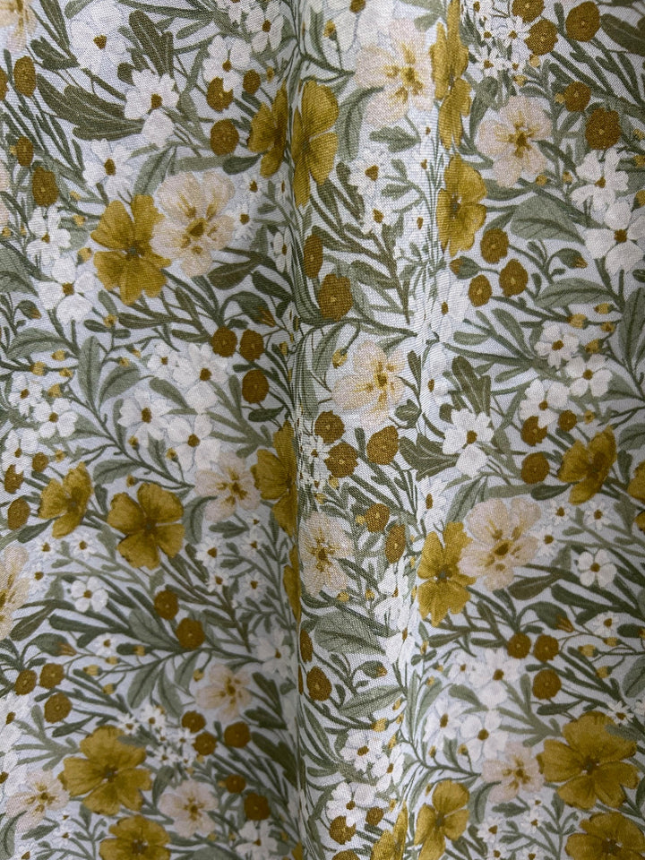 Made in USA. Shop the Mustard Floral cotton midi dress by Retrolicious, with a high neckline, full swing skirt and hidden pockets. Sizes XS–4X.
