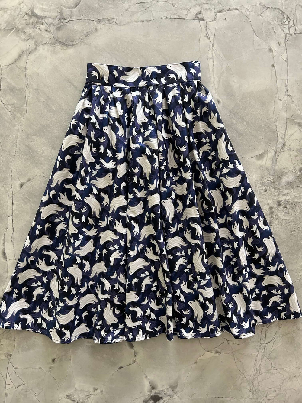 Made in USA, the Retrolicious Doris skirt features a Flying Ghosts print, 100% cotton, pockets, and a stretchy back waist. Runs small; size up.