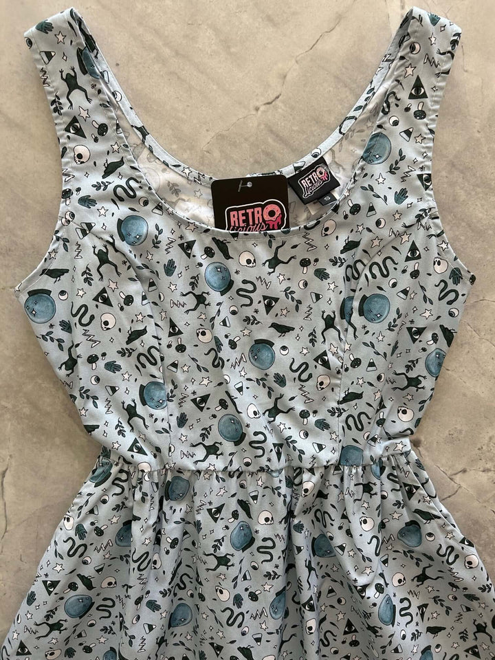 Made in USA. Shop the Witching Hour cotton fit-and-flare dress by Retrolicious, with a scoop neck, pockets and vintage-inspired style. Perfect for Halloween.