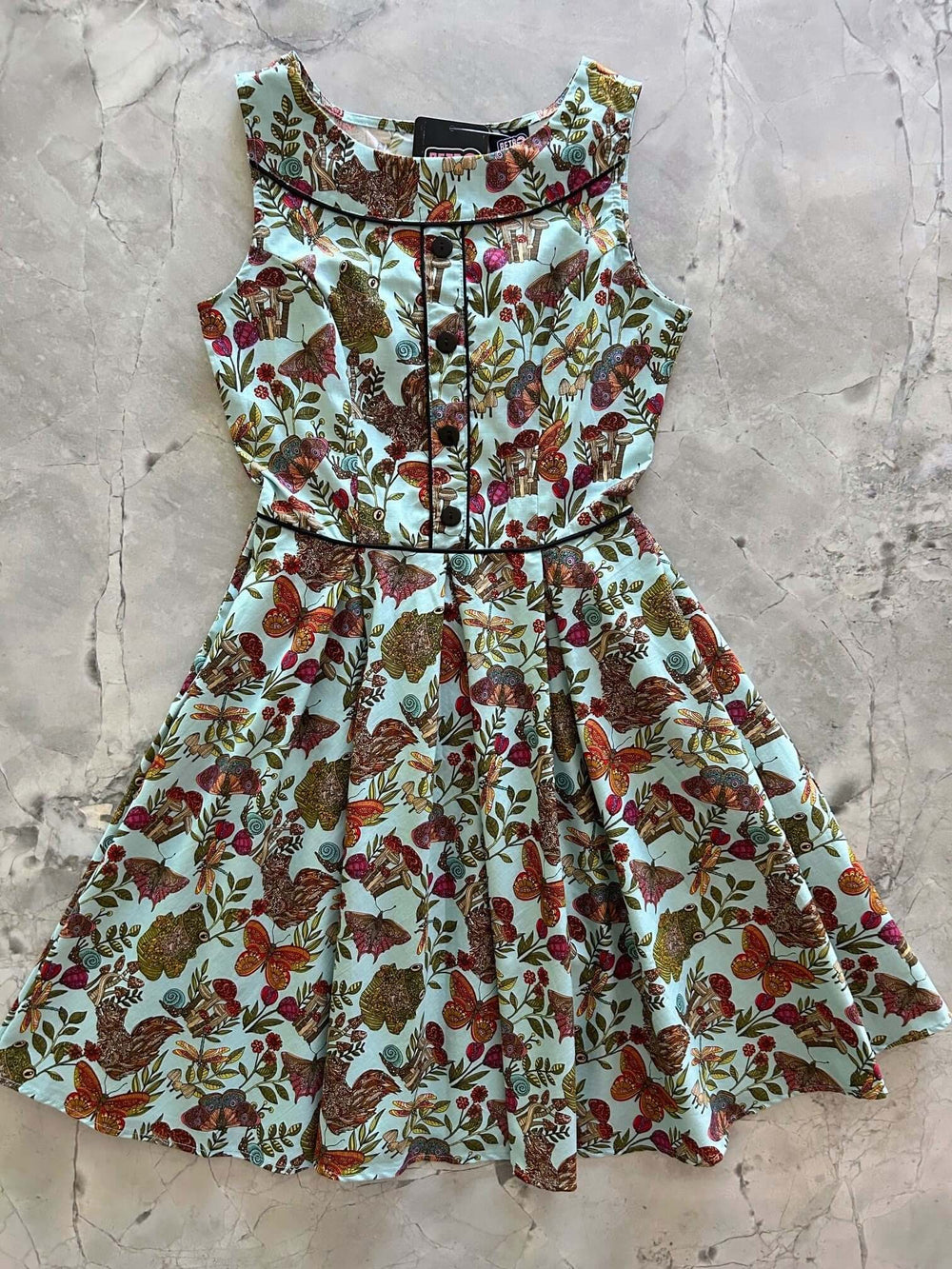 Vintage Style Dress Looking for a classic vintage style dress? Our Elizabeth cut with all its details is everything you could want and more! Shown in our Woodland Whimsy print, this cotton dress features piping details throughout the bodice
