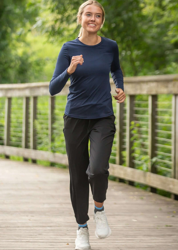 The SoftTECH™ Pro Top in Navy Blue delivers performance and comfort in one versatile piece. Engineered in USA with WSI Sportswear signature SoftTECH™ fabric, this top features a relaxed crew neck silhouette that moves with you through workouts and everyday wear. The lightweight, breathable construction keeps you cool during activity, while 4-way stretch ensures unrestricted movement in every direction. Built-in UPF 50 protection 