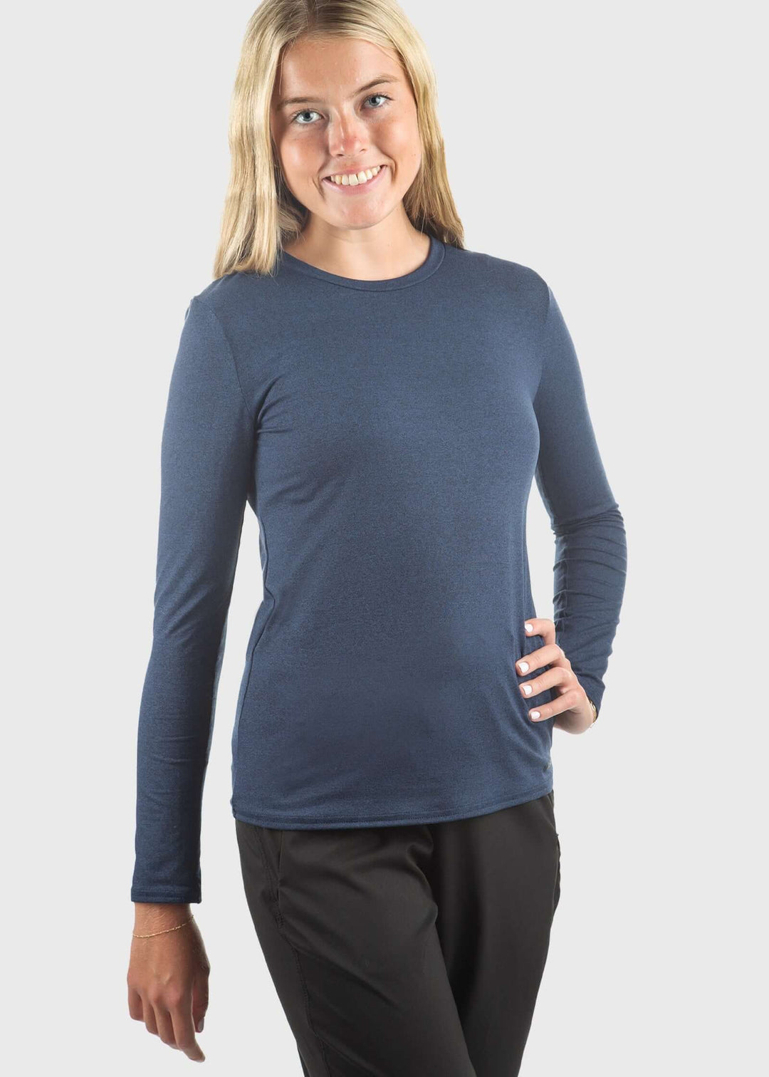 The SoftTECH™ Pro Top in Navy Blue delivers performance and comfort in one versatile piece. Engineered in USA with WSI Sportswear signature SoftTECH™ fabric, this top features a relaxed crew neck silhouette that moves with you through workouts and everyday wear. The lightweight, breathable construction keeps you cool during activity, while 4-way stretch ensures unrestricted movement in every direction. Built-in UPF 50 protection 