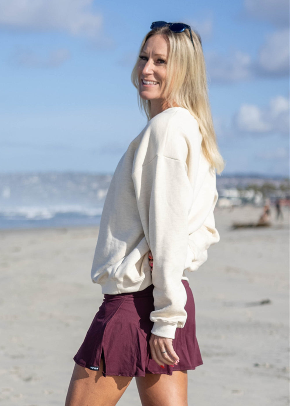 Experience all-day comfort with this USA Mid-Weight Fleece Sweatshirt. Crafted from a durable 14-ounce heavy-weight fleece, it offers warmth and breathability for cooler spring days. Featuring a loose fit, ribbed cuffs, and hem, this mid-layer is perfect for effortless layering. Show your pride with the classic white USA graphic, and enjoy the quality of a garment proudly made in the USA since 1990.