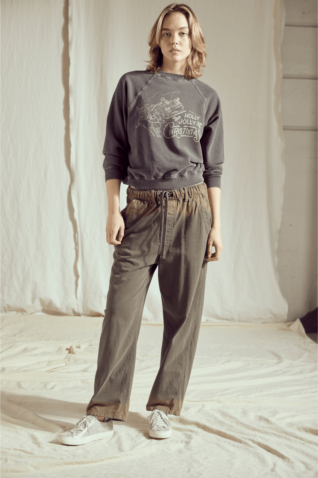 Ditch the blinding lights and embrace the cool side of the holiday season! This Holly Jolly Vintage Black Sweatshirt brings a rock-and-roll edge to classic Christmas cheer