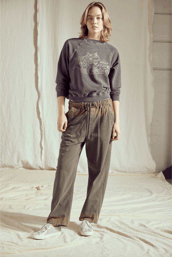 Ditch the blinding lights and embrace the cool side of the holiday season! This Holly Jolly Vintage Black Sweatshirt brings a rock-and-roll edge to classic Christmas cheer