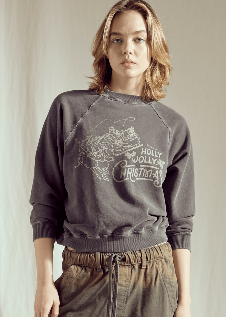 Ditch the blinding lights and embrace the cool side of the holiday season! This Holly Jolly Vintage Black Sweatshirt brings a rock-and-roll edge to classic Christmas cheer