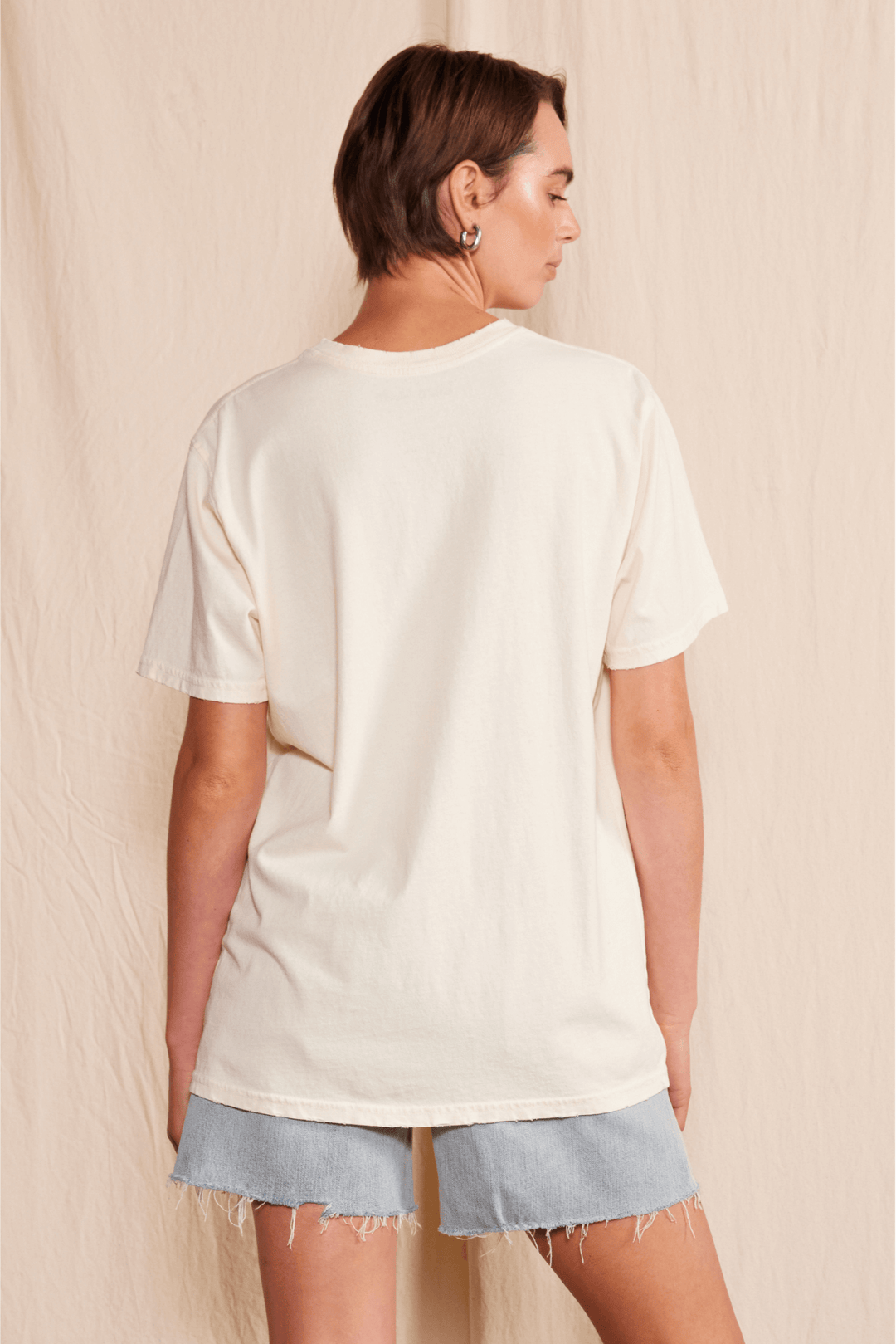 Get ready to cool down this summer with the Lainey Wilson Country's Cool Again Tee. Made from 100% organic cotton, this unisex crew neck tee will have you feeling comfortable and stylish. The tee boasts a playful cowboy style, perfect for any country music fan. Made in USA