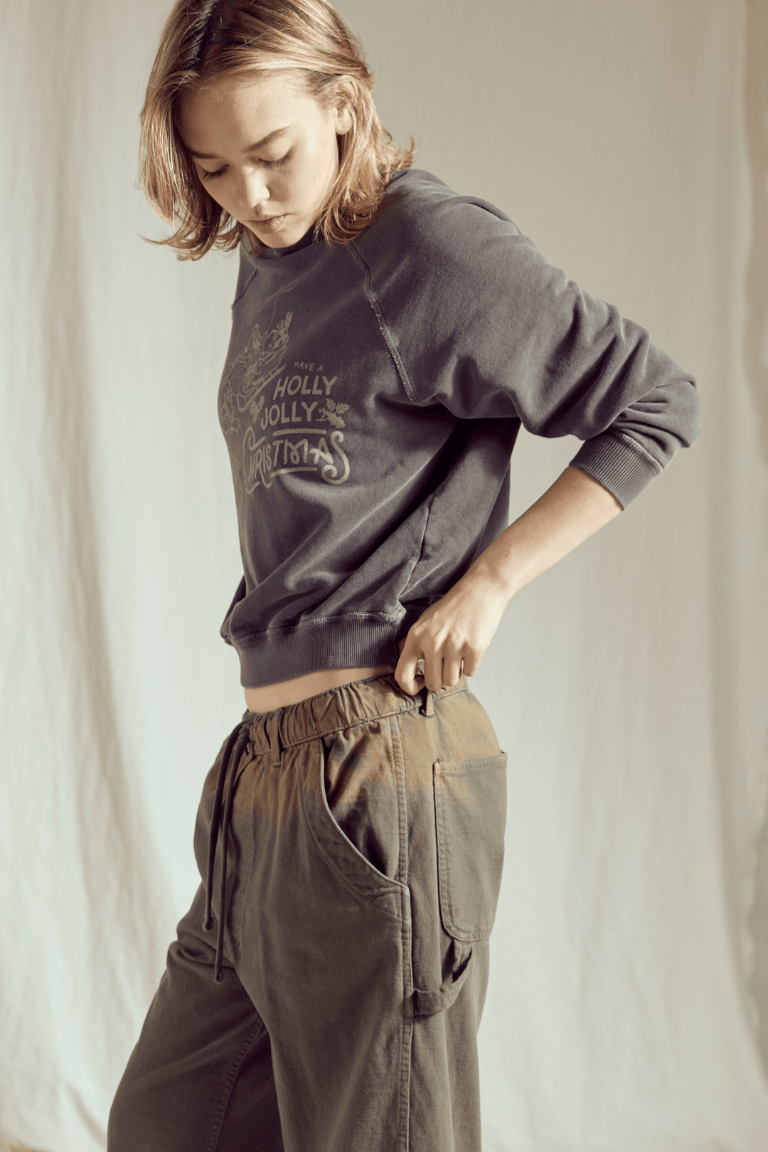 Ditch the blinding lights and embrace the cool side of the holiday season! This Holly Jolly Vintage Black Sweatshirt brings a rock-and-roll edge to classic Christmas cheer