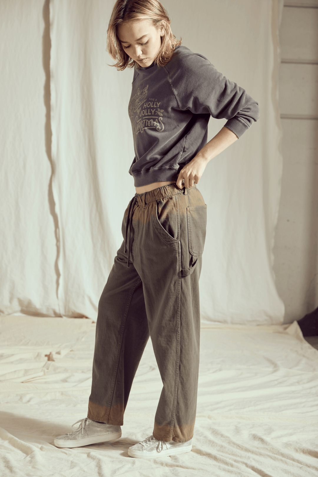 Ditch the blinding lights and embrace the cool side of the holiday season! This Holly Jolly Vintage Black Sweatshirt brings a rock-and-roll edge to classic Christmas cheer