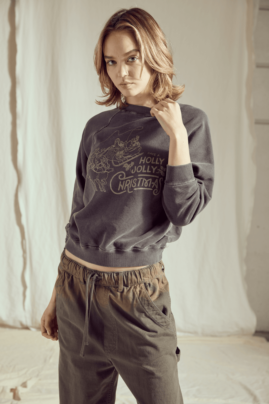 Ditch the blinding lights and embrace the cool side of the holiday season! This Holly Jolly Vintage Black Sweatshirt brings a rock-and-roll edge to classic Christmas cheer