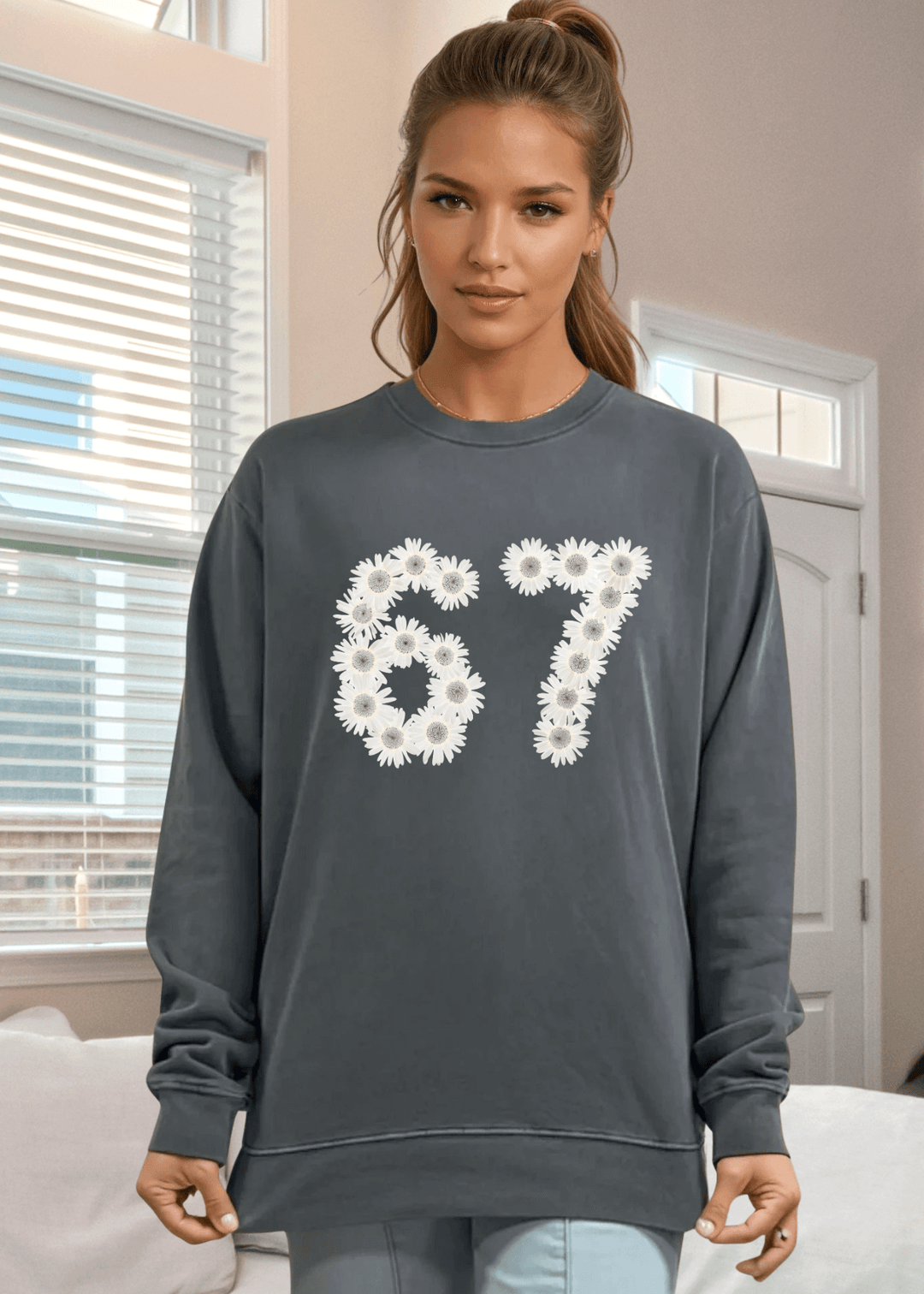Elevate your everyday wardrobe with this heavyweight pigment-dyed cotton sweatshirt, crafted right here in the USA. Featuring a striking 67 floral graphic on a rich evergreen base, it's the perfect blend of artistic style and comfort. 