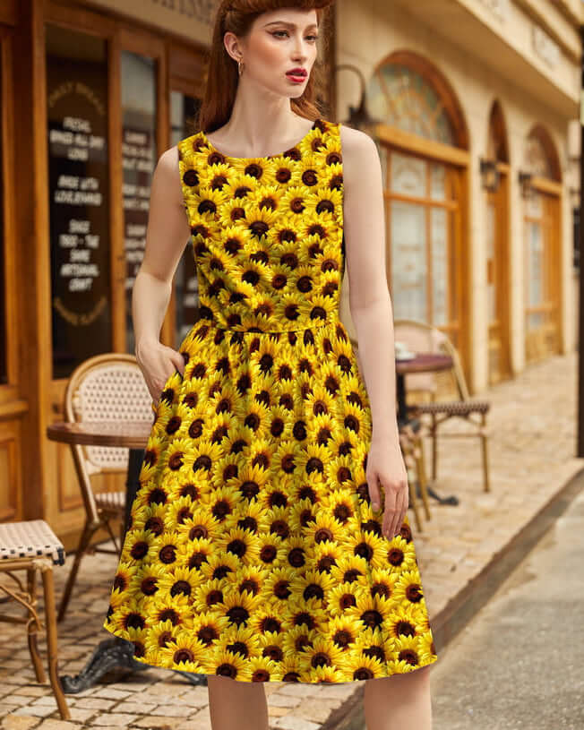 Made in USA by Retrolicious, this 100% cotton sunflower vintage dress features a high neckline, full skirt, pockets, and back zip. Sizes XS–4X.