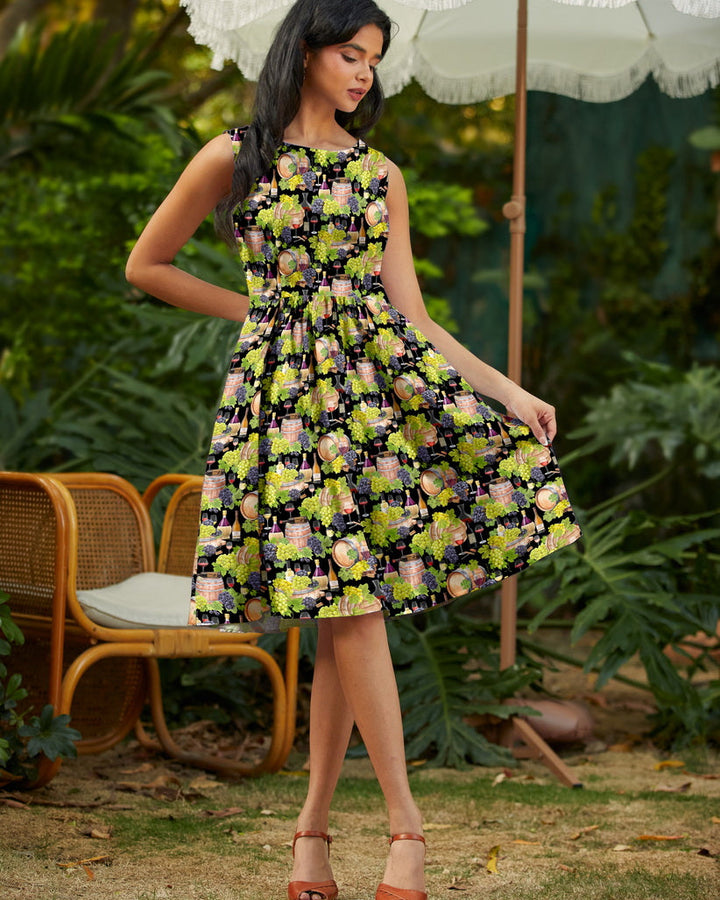 Made in USA. Shop the Wine Vintage Dress by Retrolicious in 100% cotton, with a high neckline, longer full skirt and hidden pockets. Sizes XS–4X.
