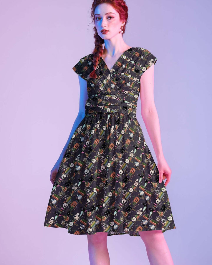 Made in USA. Shop the Potions Greta cotton dress by Retrolicious, with a vintage-inspired V-neck, gathered waist, pockets.  Perfect for Halloween.