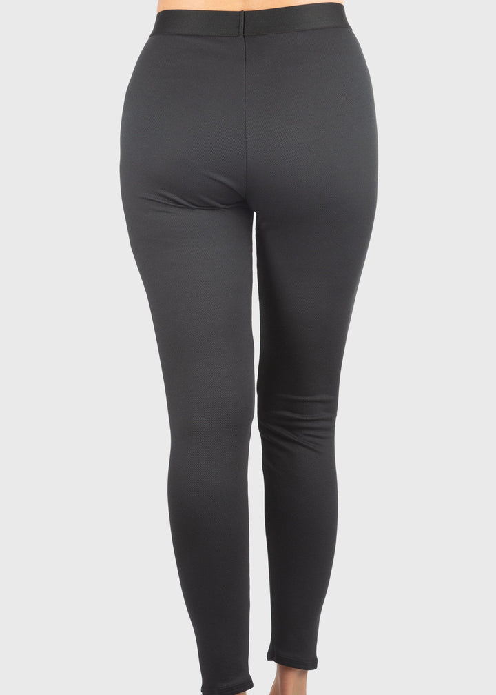 Experience unmatched warmth and comfort with the HEATR® Tundra Base Layer pant—our top-selling choice for lightweight, effective insulation. Designed without a women’s cut, this thin, flexible layer easily fits under any outfit, providing consistent heat from 0° to 75° F. The HEATR® technology integrated throughout the pant supports muscle recovery while keeping you dry and cozy during all your outdoor winter activities. Featuring an exposed waistband for added comfort, these base layer pants are ideal for 