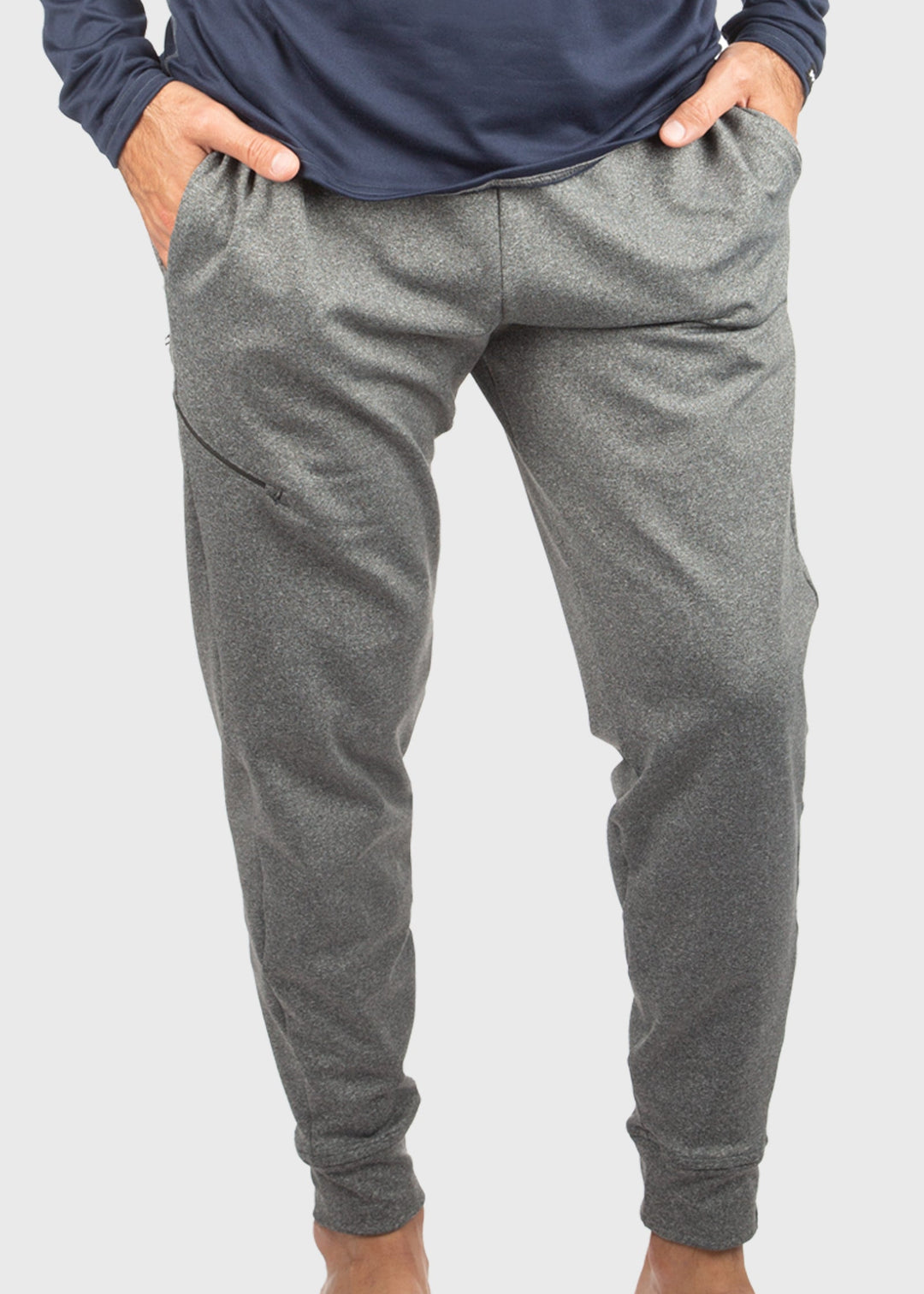 Crafted from durable 8oz ProWikMax™ fleece, these Men's sweatpants offer a loose fit and a brushed lining for exceptional comfort and warmth. The fabric blend of 88% polyester and 12% spandex ensures flexibility and lasting wear. Thoughtfully designed with side pockets, a welt leg pocket, and cuffed hems for a secure fit, they perform well as a standout layering option through fall and winter. Proudly made in the USA since 1990, these sweatpants combine expert craftsmanship with functional design.