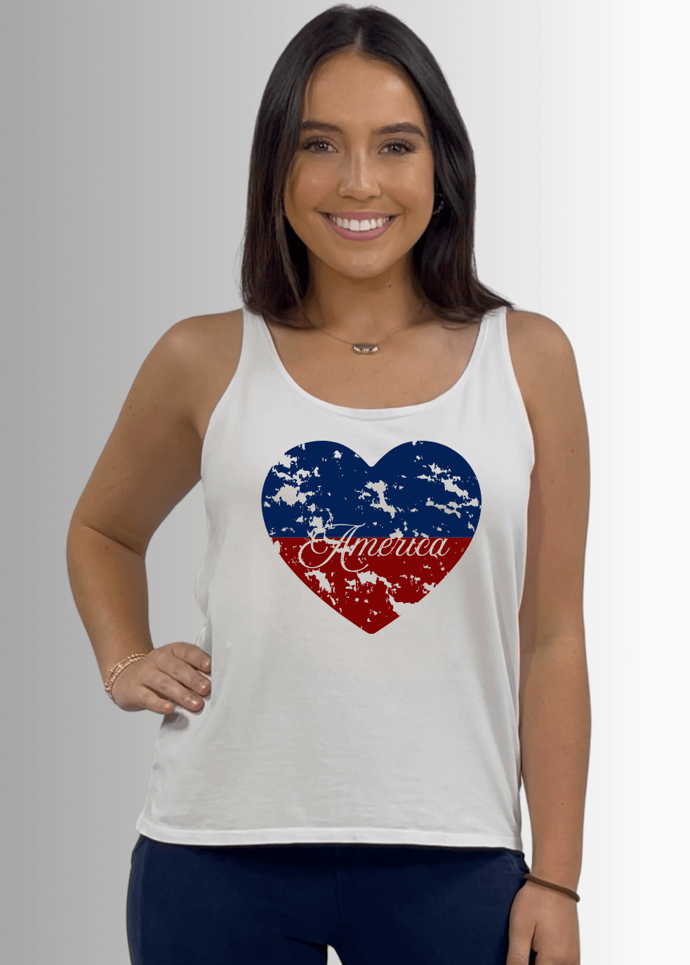Made in USA Patriotic Distressed Red White and Blue Heart Graphic Loose Fit Tank Top, Twenty Four Seven Tank Top | Women's Sustainable and durable premium America-made cotton tank top, in Garment Washed White Color, Wide Round Neck, Loose Fit, Perfect for Layering | Classy Cozy Cool Style C11315