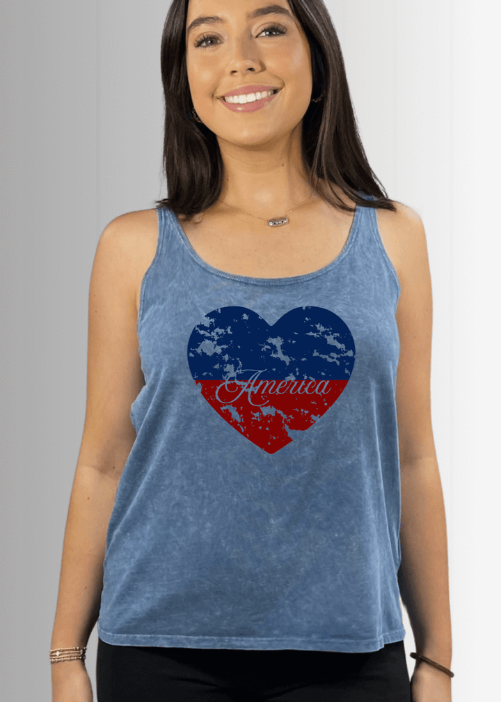Made in USA Patriotic Distressed Red White and Blue Heart Graphic Loose Fit Tank Top, Twenty Four Seven Tank Top | Women's Sustainable and durable premium America-made cotton tank top, in Garment Washed Light Denim Blue Color, Wide Round Neck, Loose Fit, Perfect for Layering | Classy Cozy Cool Style C11315