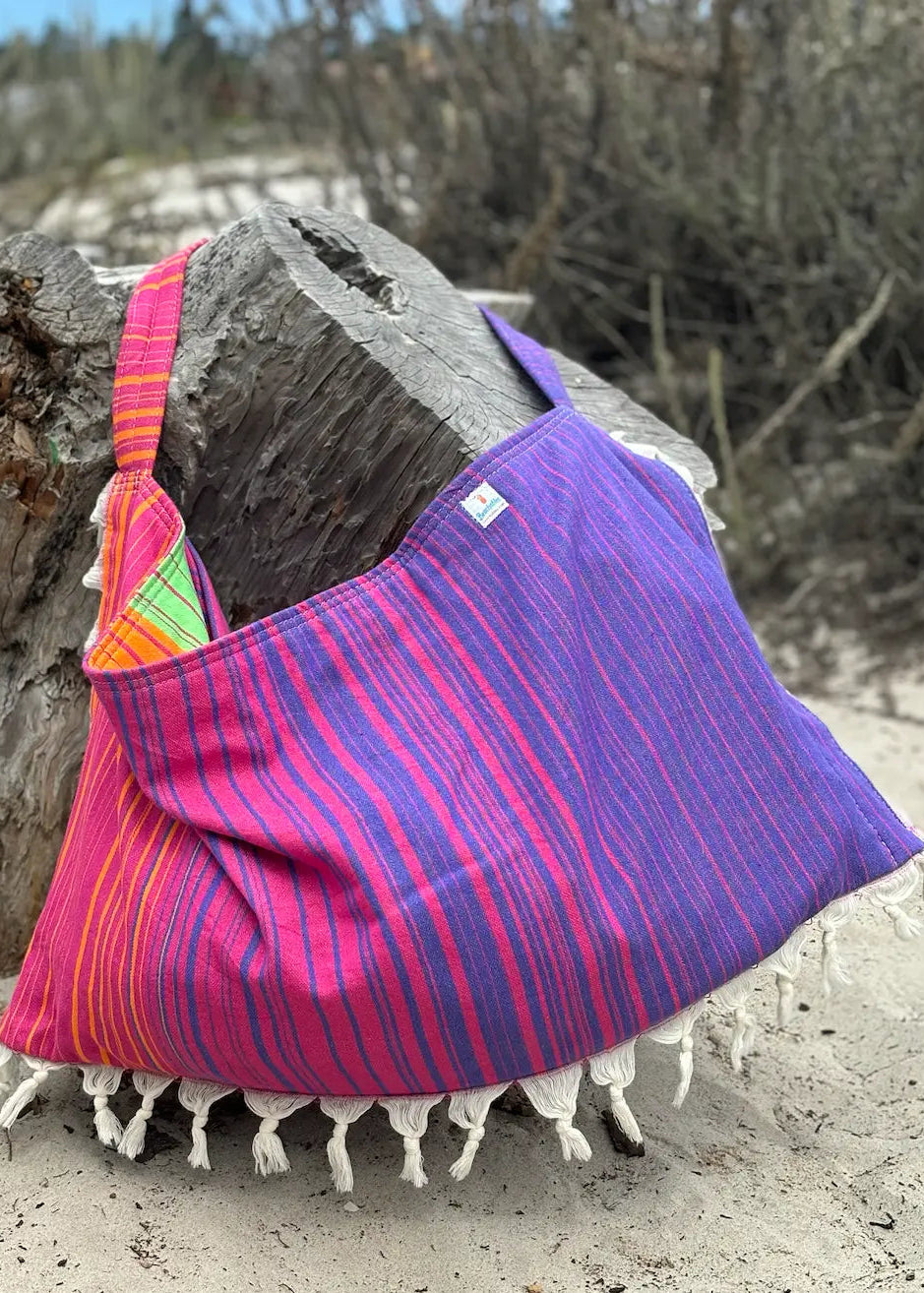 Shop the Beachables Striped 3-in-1 Turkish Cotton Beach Bag – converts from bag to towel to chair cover. Sand-resistant, quick-dry, machine washable. Made in USA.