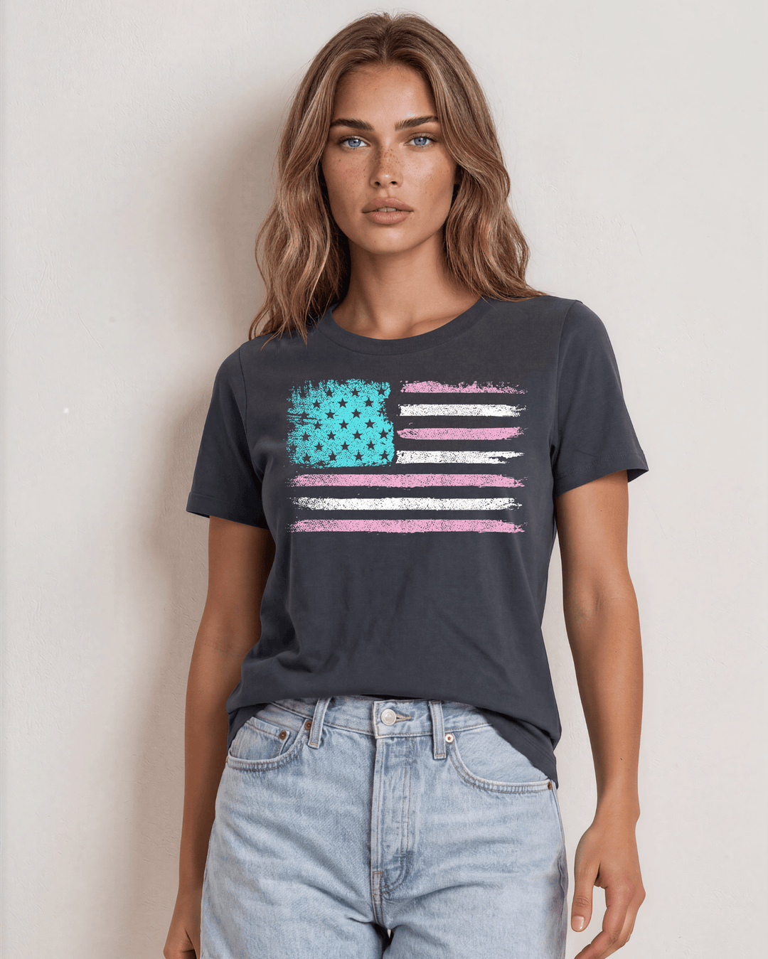 Distressed American flag graphic tee in aqua, pink &amp; white on graphite. 100% cotton, USA-milled fabric, made in USA. A feminine patriotic twist.