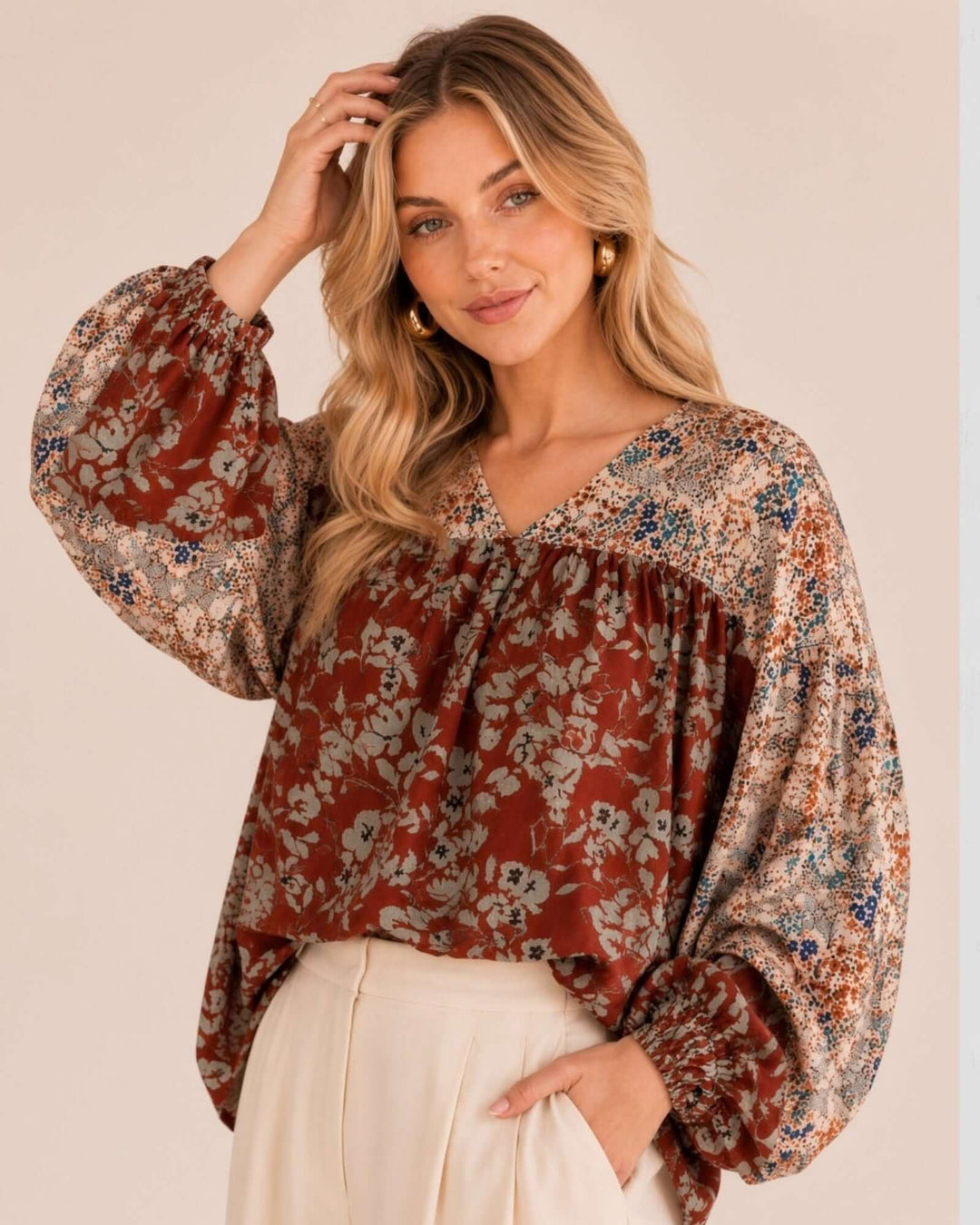 Made in USA women's rust and cream mixed floral V-neck babydoll top with balloon sleeves and elastic cuffs, front view