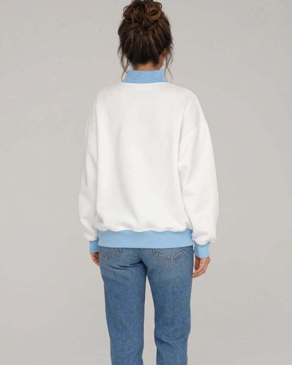Women's white oversized mock neck sweatshirt with light blue ribbed trim featuring the Artsy Christmas Tree Graphic design, back view, plain white back, Made in USA