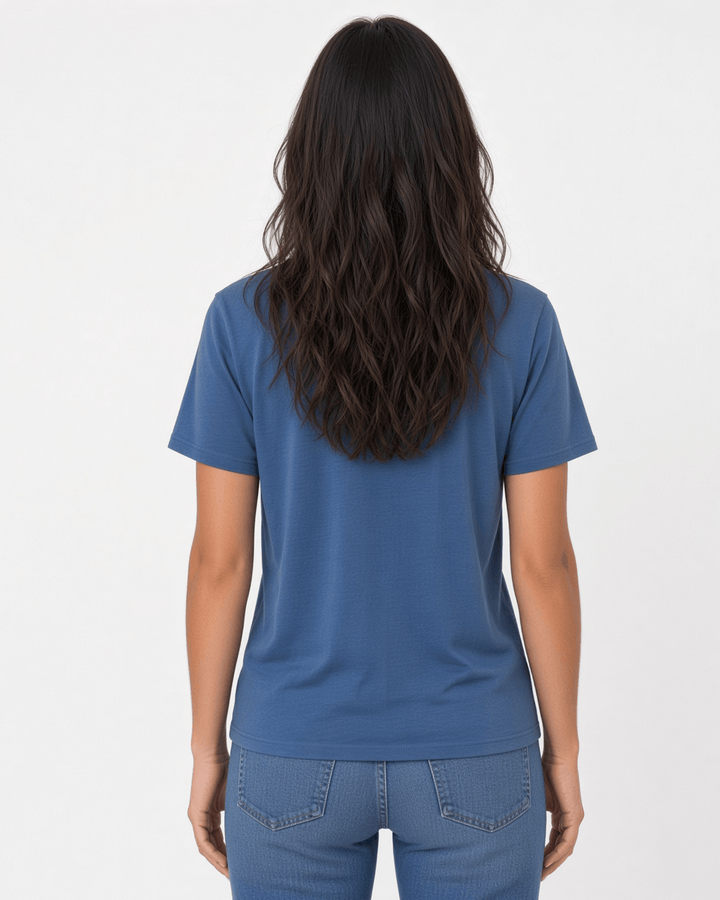 Made in USA The Boyfriend Cotton Washed T-Shirt - Blue Steel: back view of blue crew neck short sleeve tee on female model with jeans
