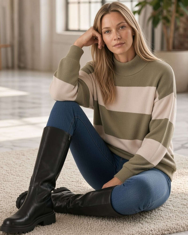 Woman wearing Made in USA olive and cream striped mock neck sweater with a relaxed fit, soft stretch knit fabric, long sleeves, and ribbed trim.
