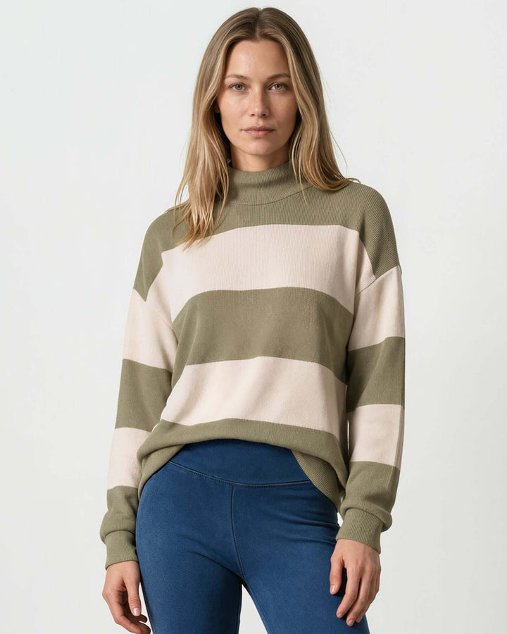 Woman wearing Made in USA olive and cream striped mock neck sweater with a relaxed fit, soft stretch knit fabric, long sleeves, and ribbed trim.