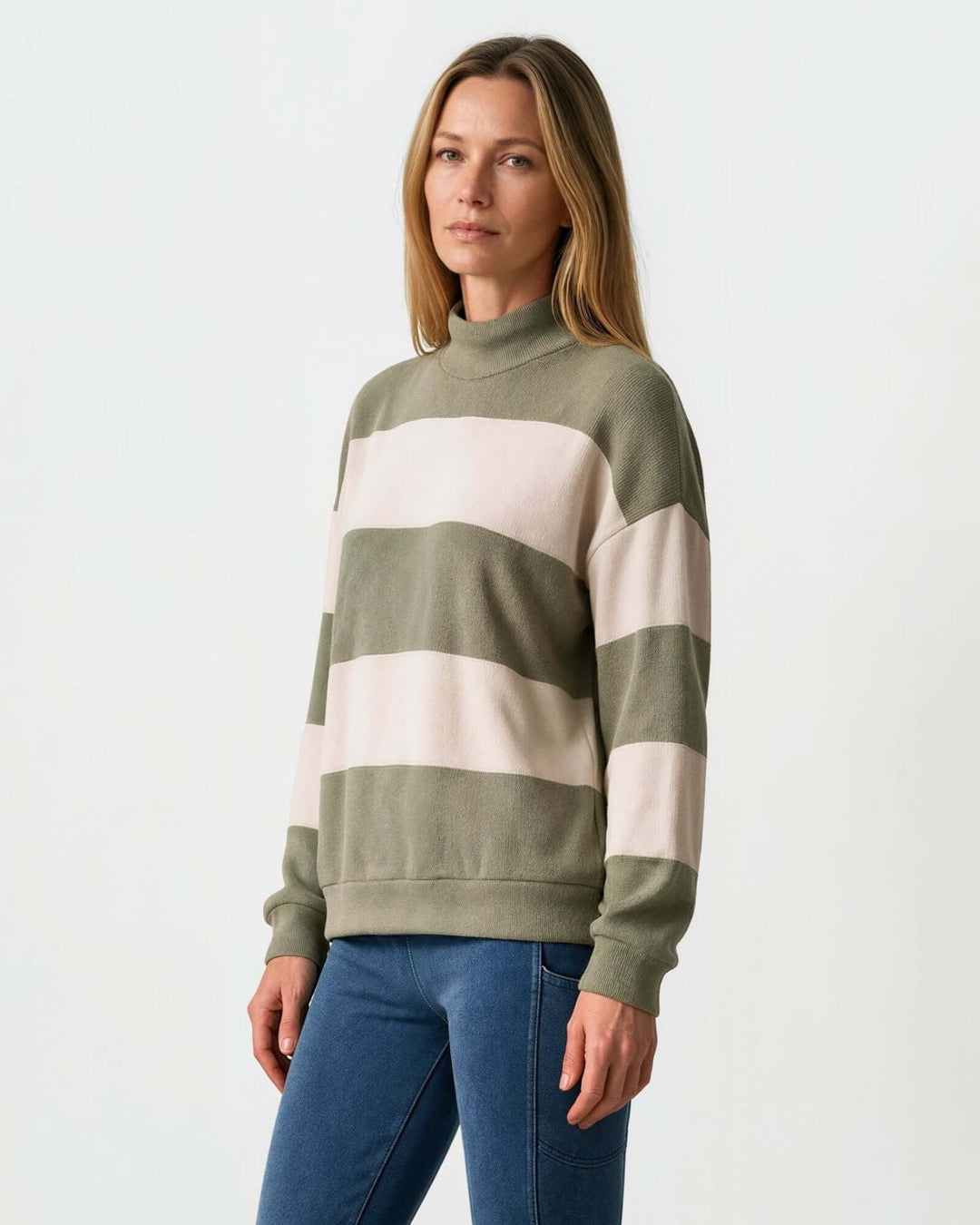 Woman wearing Made in USA olive and cream striped mock neck sweater with a relaxed fit, soft stretch knit fabric, long sleeves, and ribbed trim.