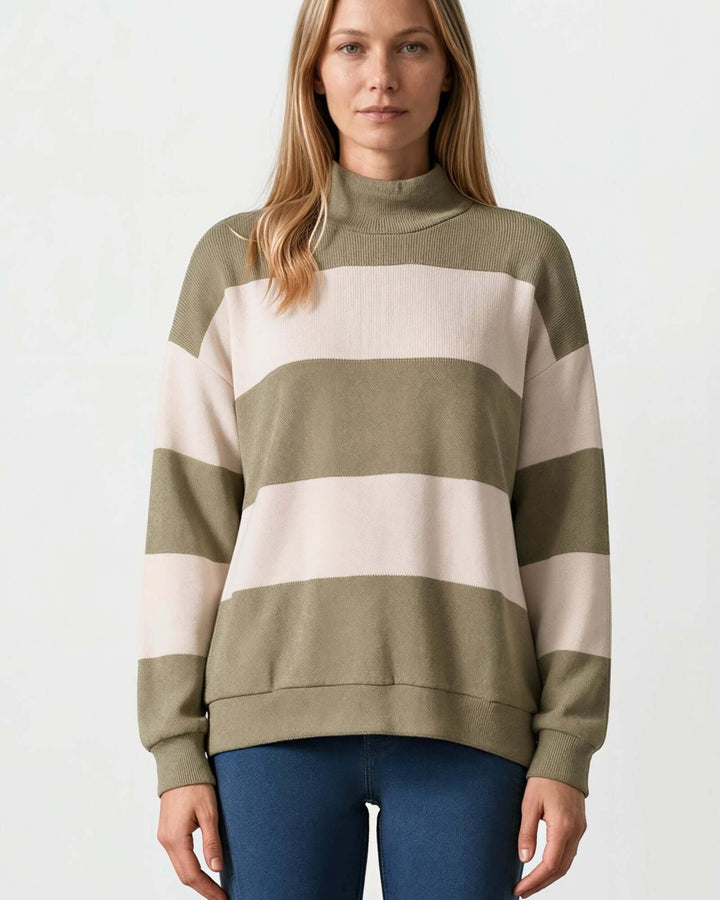 Woman wearing Made in USA olive and cream striped mock neck sweater with a relaxed fit, soft stretch knit fabric, long sleeves, and ribbed trim.