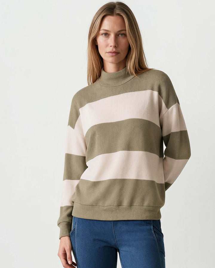 Woman wearing Made in USA olive and cream striped mock neck sweater with a relaxed fit, soft stretch knit fabric, long sleeves, and ribbed trim.