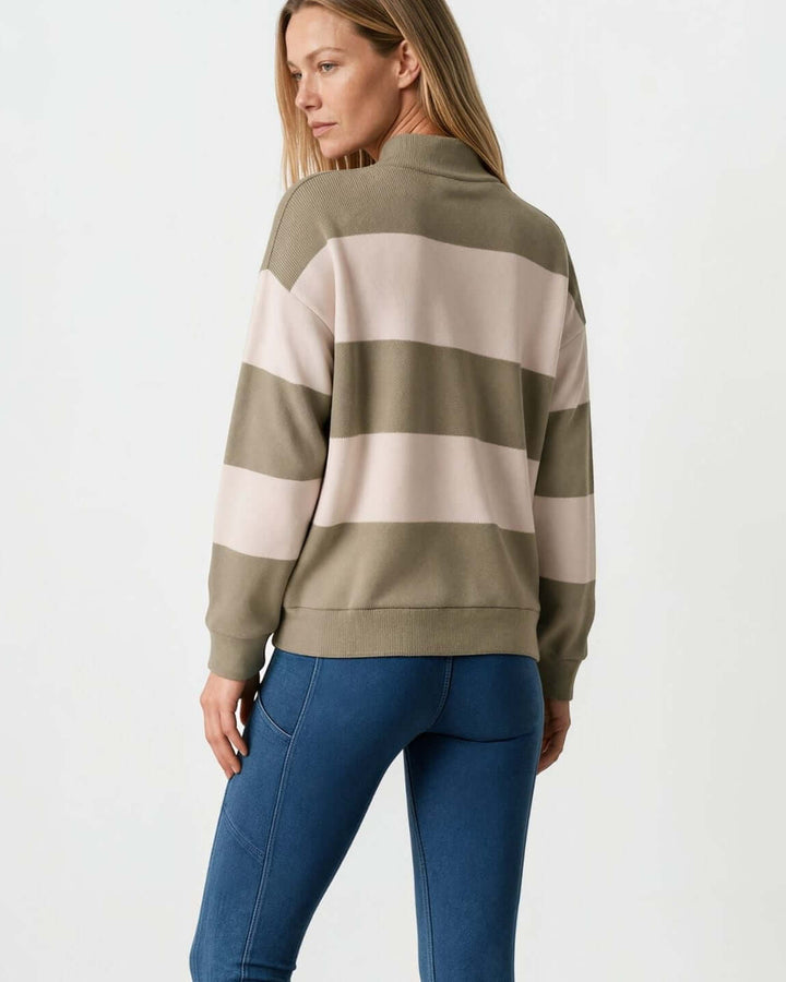 Woman wearing Made in USA olive and cream striped mock neck sweater with a relaxed fit, soft stretch knit fabric, long sleeves, and ribbed trim.