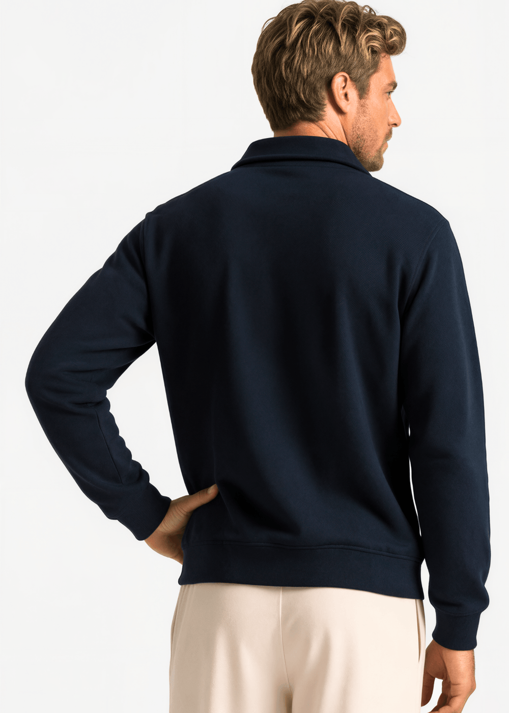 Made in USA men's cotton True American navy quarter-zip pullover with a stand collar, long sleeves, ribbed cuffs and hem, shown on a male model.