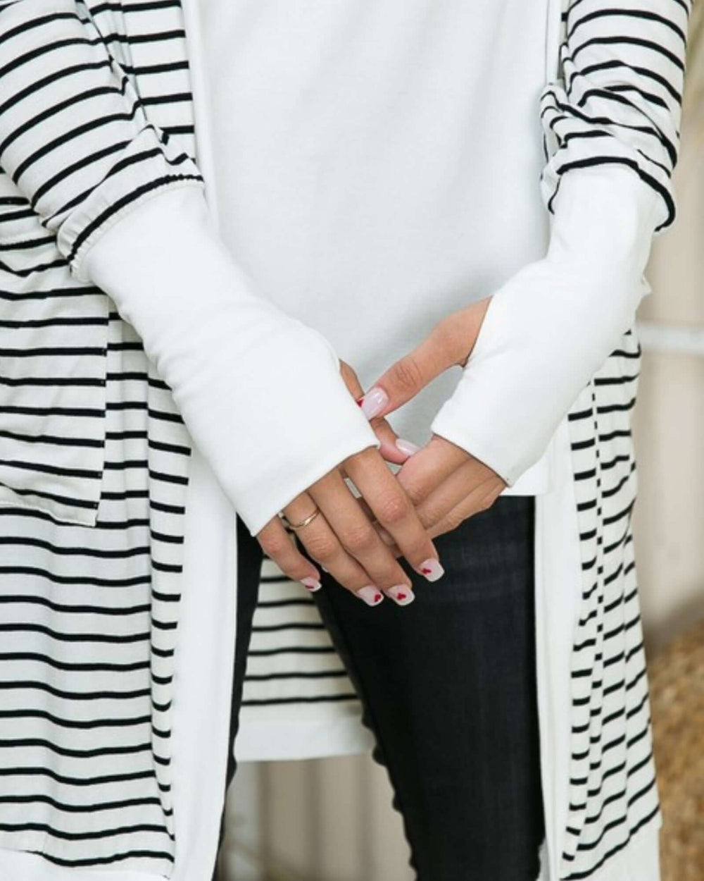 Made in USA women's white and black striped open cardigan, close-up of white cuffs and stripe detail