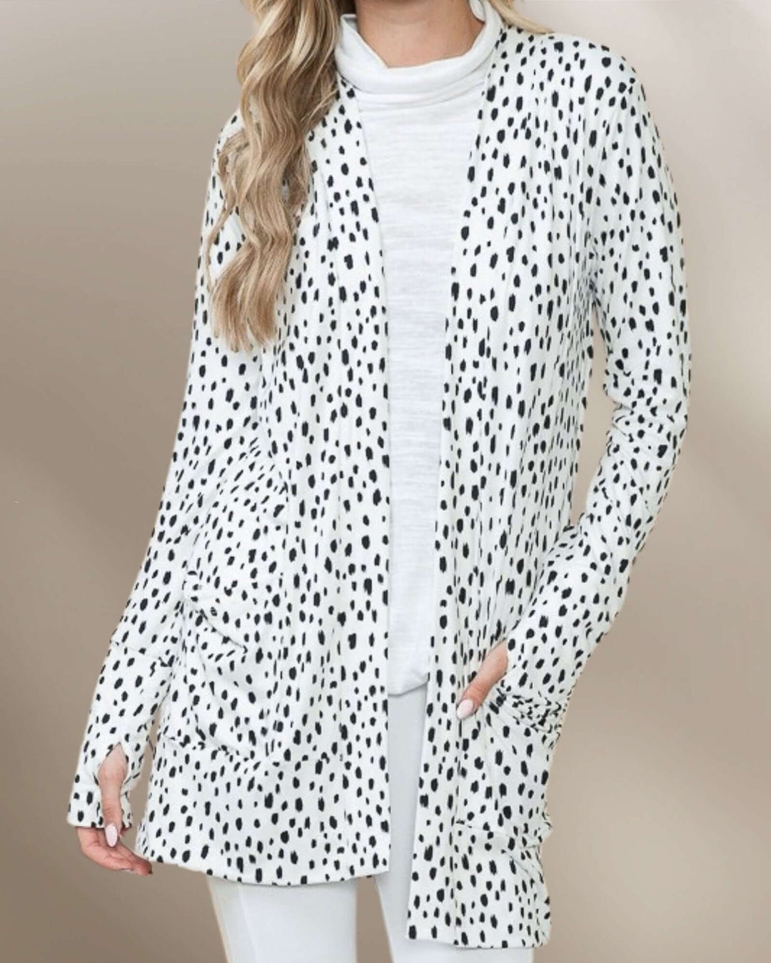 Made in USA Dolly Dot Print Cardigan: close front view of dot print with thumbhole cuffs
