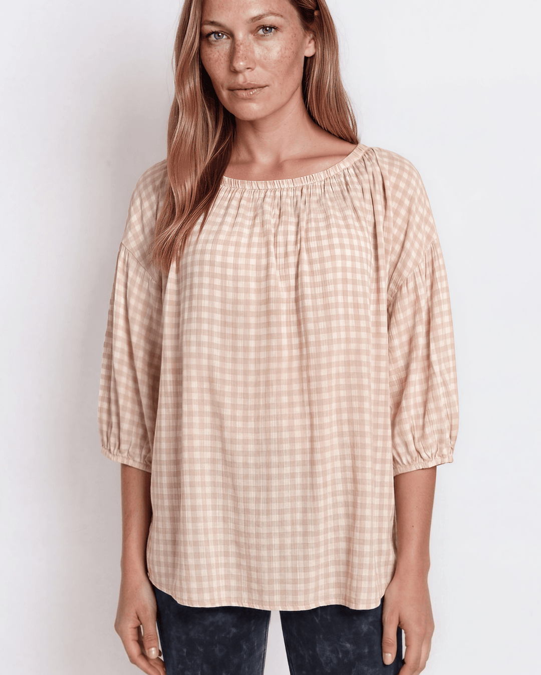 Rose gingham plaid woven peasant blouse with a stretchy elastic scoop neckline, 3/4 length puff sleeves with elasticized cuffs, and a relaxed flowy silhouette in 100% rayon. Made in USA