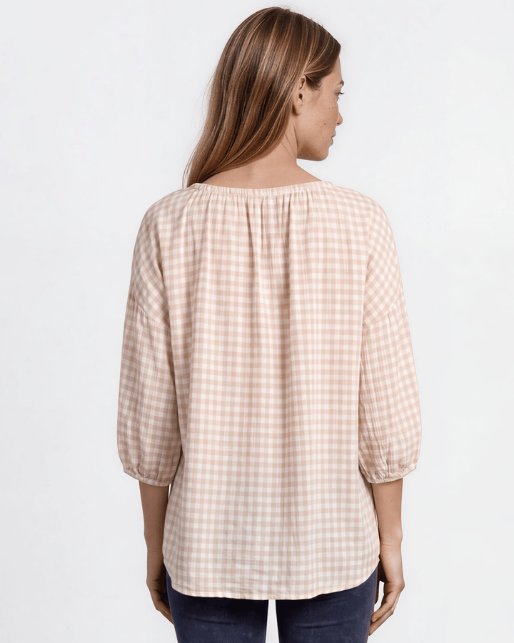 Rose gingham plaid woven peasant blouse with a stretchy elastic scoop neckline, 3/4 length puff sleeves with elasticized cuffs, and a relaxed flowy silhouette in 100% rayon. Made in USA