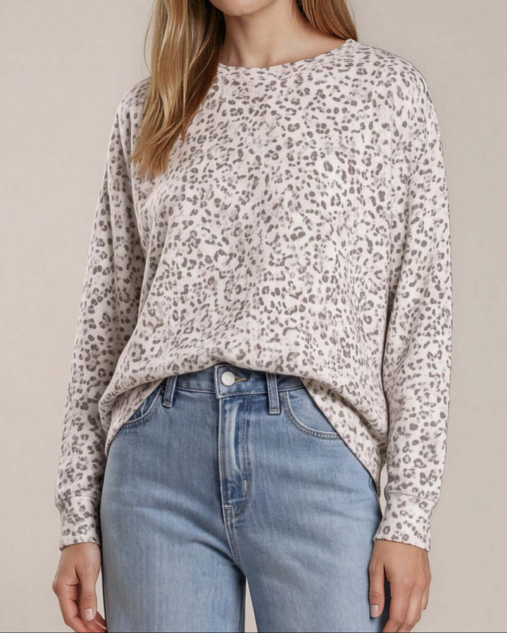 Made in USA Amelia Animal Print Oversized Sweatshirt: close-up front of cream leopard print with light jeans