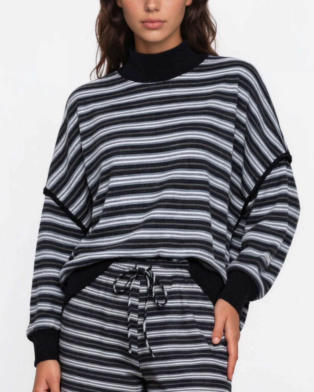 Made in USA women's black and gray striped relaxed fit crewneck long sleeve top with ribbed trim, front view styled with matching striped shorts
